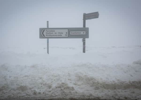 Fog adds to the snow near Blakey Ridge on the North York Moors at Kirbymoorsde, where wind also caused huge drifts. Picture: Ross Parry Agency