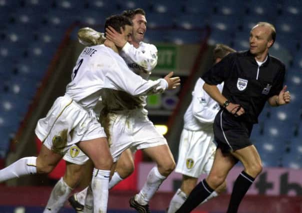 Robbie Keane congratulates Ian Harte on his successful penalty at Aston Villa in 2001.