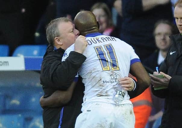 Souleymane Doukara celebrates his goal with manager Steve Evans.
