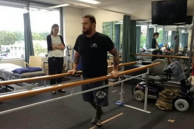 Lance Corporal Clive Smith takes his first steps after a Â£90,000 operation to fit titanium sockets to the remaining bones in his legs. See News Team story NTIHERO; A war hero who was "betrayed" by the NHS after he lost both his legs in a Taliban bomb blast has taken his first steps on his new Â£90,000 bionic limbs. Clive Smith, 30, had to remortgage his home to pay for the surgery in Australia which joined titanium rods to his thigh bones so that he could snap them onto his prosthetics. He was left badly injured after he stepped on a bomb as he led a mine sweeping patrol in the Nahr-e Saraj district of Helmand Province in October 2010. The Lance Corporal lost both legs after triggering the Taliban planted IED device while serving with the 33 Engineer Regiment during the height of the conflict.