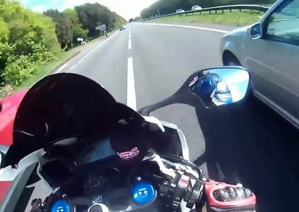 Videograb showing Robert Hammond's terrifying 140mph motorbike journey. See SWNS story SWBIKE: This is the moment a 60-year-old motorcyclist sped down country lanes at up to 140 miles per hour. Despite his age, Robert Hammond was arrested after doing a wheelie at 80mph in a 50mph zone. When cops studied his helmet cam they were shocked at what they found. Hammond was jailed on Friday for two years after pleading guilty to four counts of dangerous driving.