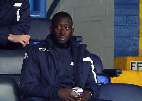 Toumani Diagouraga watches the match in the West Stand on Saturday. (Picture: Tony Johnson)