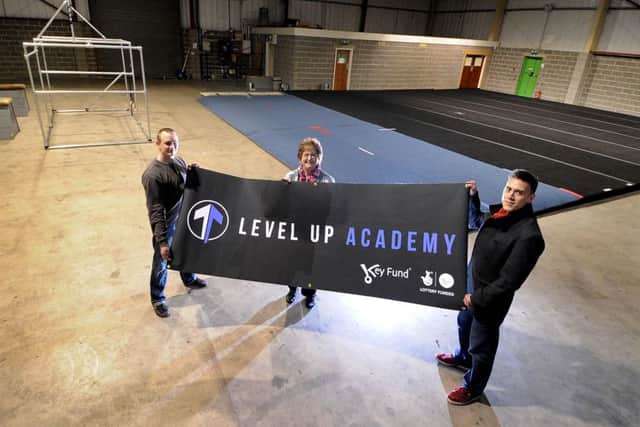 Jim Key and Martin Wan, directors of the Level Up Academy, with Coun Angela Gabriel (Lab, Beeston and Holbeck). Picture by James Hardisty.