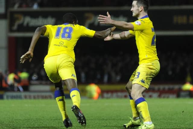 Mustapha Carayol turns to Lewis Cook to celebrate his equaliser.