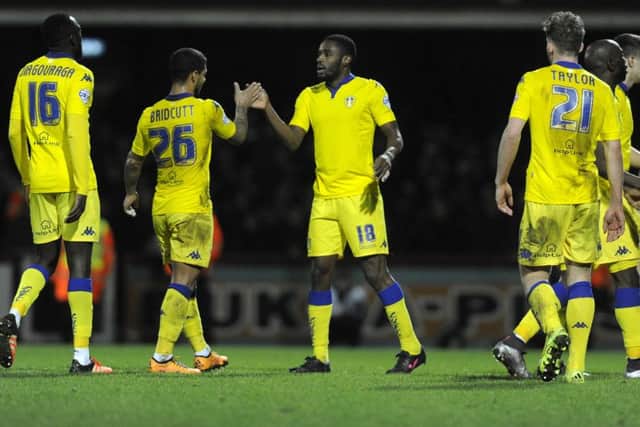 Mustapha Carayol celebrates his equaliser, right, with Liam Bridcutt