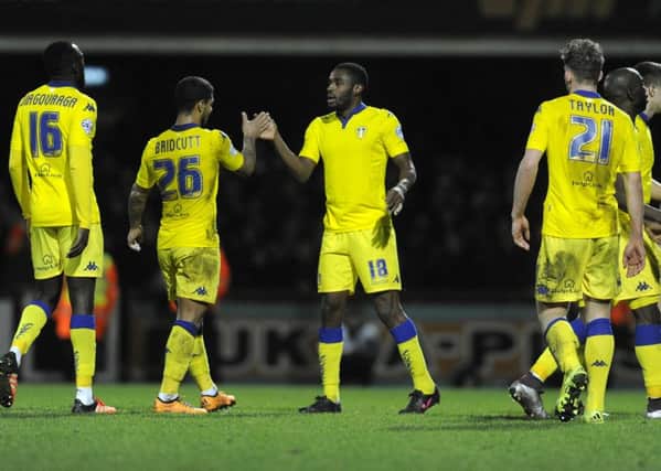 Mustapha Carayol celebrates his equaliser, right, with Liam Bridcutt