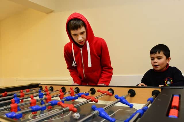 19 Jan 2015...... Danny Hopton and Theo Cutts have a game of table football at the launch a new Autistic Spectrum youth group, called Fusion in Wakefield. Picture Scott Merrylees