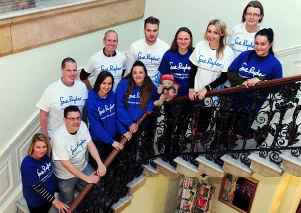 Some of the 32 adventurers who tackled the Kilimanjaro challenge are pictured at Sue Ryder Wheatfields Hospice in Leeds. Pictures: Jonathan Gawthorpe.
