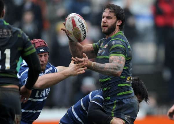 Mitch Achurch is tackled by Featherstone's Michael Channing.