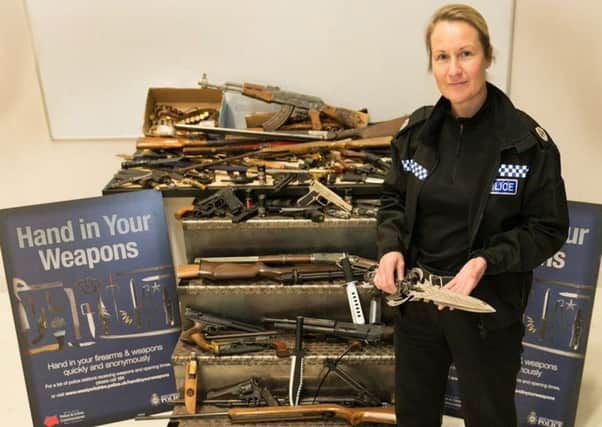 Temporary assistant chief constable Angela Williams, of West Yorkshire Police, with some of the haul.