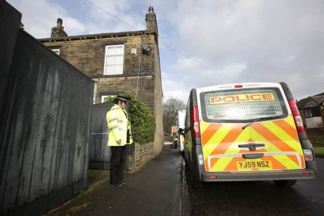 Police at the scene of the double death on Cross Road in Bradford. Picture: Ross Parry Agency