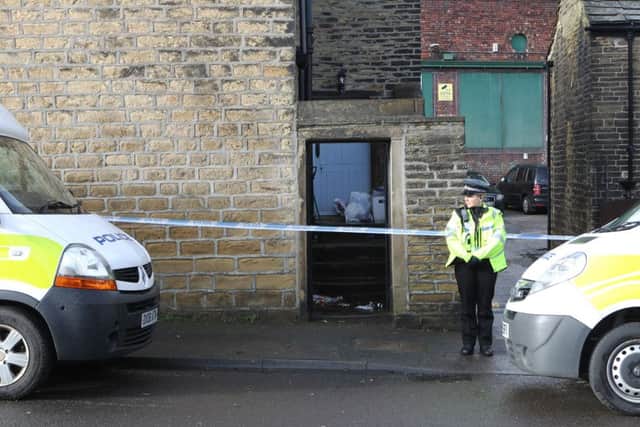 Police at the scene of the double death on Cross Road in Bradford. Picture: Ross Parry Agency
