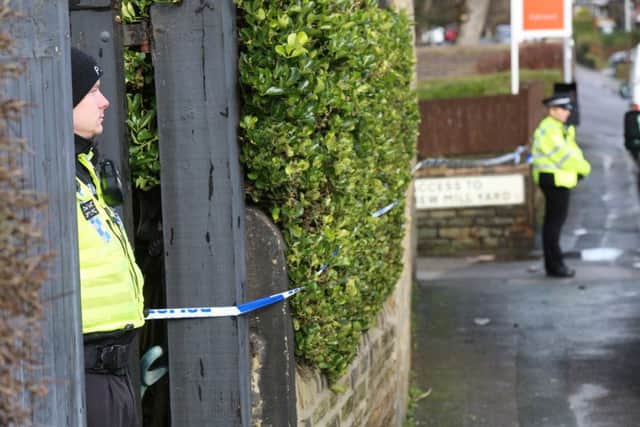 Police at the scene of the double death on Cross Road in Bradford. Picture: Ross Parry Agency