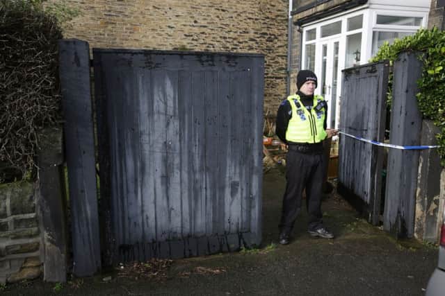 Police at the scene of the double death on Cross Road in Bradford. Picture: Ross Parry Agency