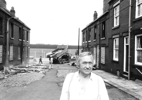 AUGUST 1981
: Peter Judge, outside his home in Hoxton Grove, Leeds, while demolition work goes ahead.