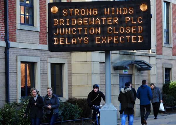 WINDY CITY: Pedestrians struggle at Bridgewater Place.
