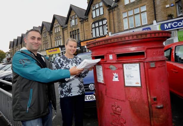 Mark Rowlinson and Lucy Clement posting their application for a free school off. It has been given the go ahead today. Picture by Simon Hulme