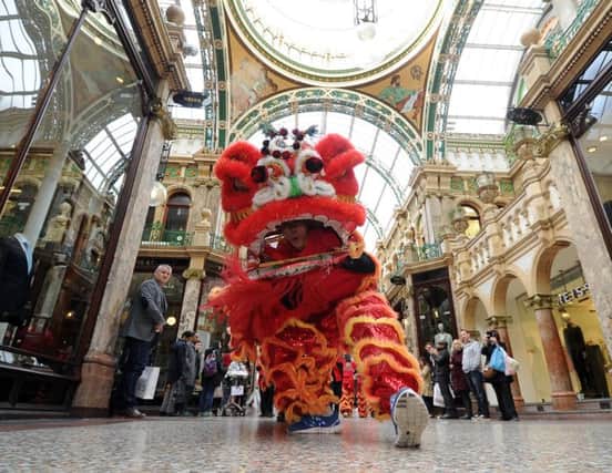 Leeds Chinese Community Association's lion dance at the Victoria Quarter in Leeds. Pictures: James Hardisty.