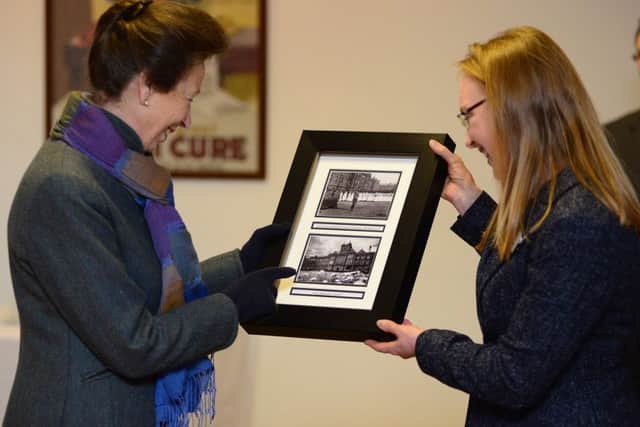Princess Anne is presented photos of her great grandfather by Joanne Bartholomew during a visit the Thackray Museum in Leeds. Picture by Scott Merrylees.