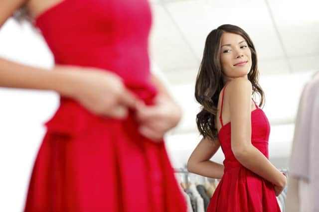 A Generic Photo of a woman trying on bright dress. See PA Feature FASHION New You. Picture credit should read: PA Photo/Thinkstockphotos. WARNING: This picture must only be used to accompany PA Feature FASHION New You.