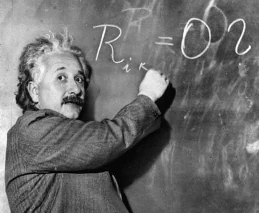 Albert Einstein writes out an equation for the density of the Milky Way on the blackboard at the Carnegie Institute, Mt. Wilson Observatory headquarters in Pasadena, Calif. in this Jan. 14, 1931 file photo.