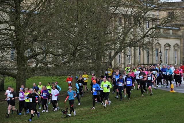 2015: Runners pass the front of Harewood House in the Age UK Harewood 10k.