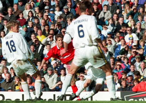 Juninho curls the ball around the Leeds defenders to score for Middlesborough in May 1997.