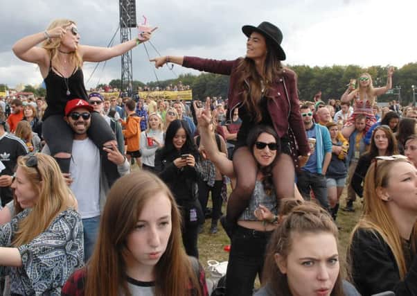 Festival goers letting their hair down at Leeds Festival.   Pic: Adrian Murray.