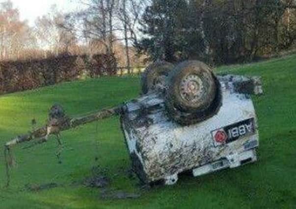 A diesel trailer dumped on the golf course.