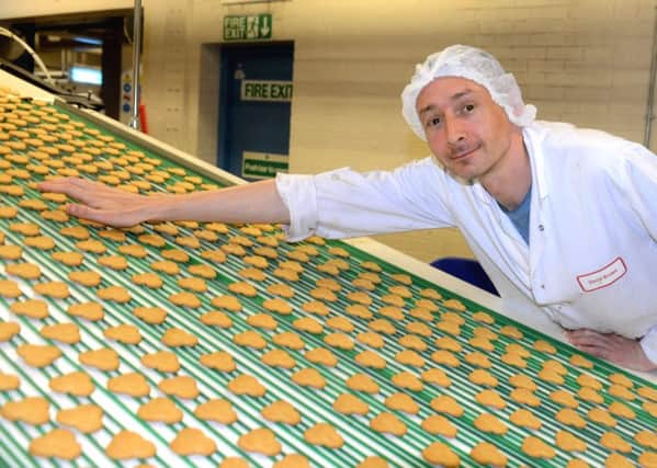 A Fox's Biscuits worker on the production line.