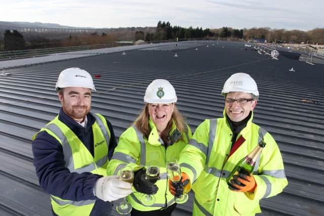 Left to right: Jon Cousins, site manager of Clugston Construction, Heather Parry, deputy chief executive of the Yorkshire Agricultural Society, and Adrian Taylor, director of P+HS Architects.
