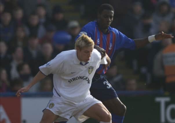 Leeds United's Alan Smith battles with Crystal Palace's Darren Powell during their FA Cup fifth round match in 2003.