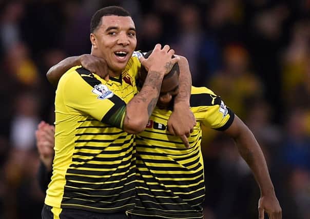 Watford's Troy Deeney and Odion Ighalo (right) celebrate victory. PIC: PA