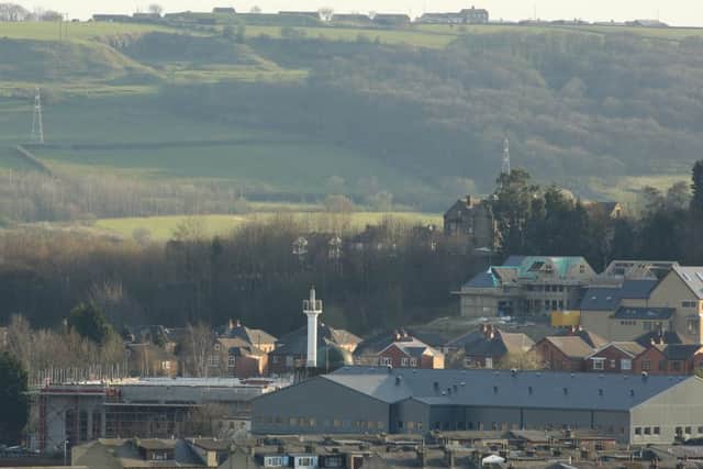 Picture shows the minaret of the Markazi Masjid sticking out of the Dewsbury skyline.