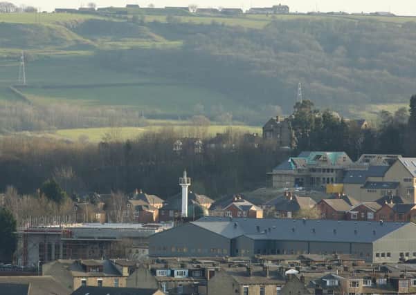 Picture shows the minaret of the Markazi Masjid sticking out of the Dewsbury skyline.