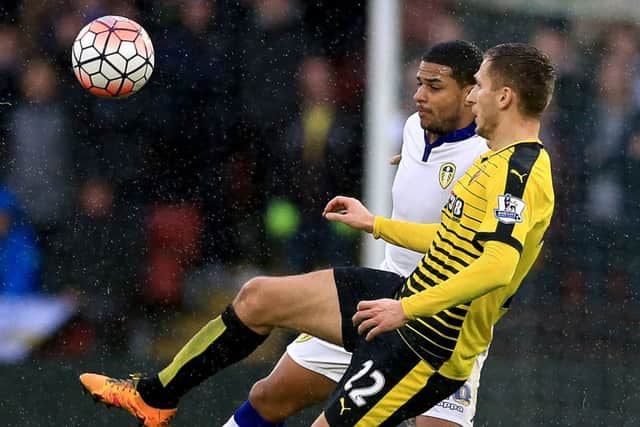 Leeds United's Liam Bridcutt (back) and Watford's Almen Abdi battle for the ball. PIC: PA