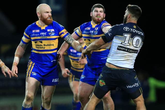 Leeds Rhinos' Mitch Garbutt (second right) was sent off for punching North Queensland Cowboys James Tamou.