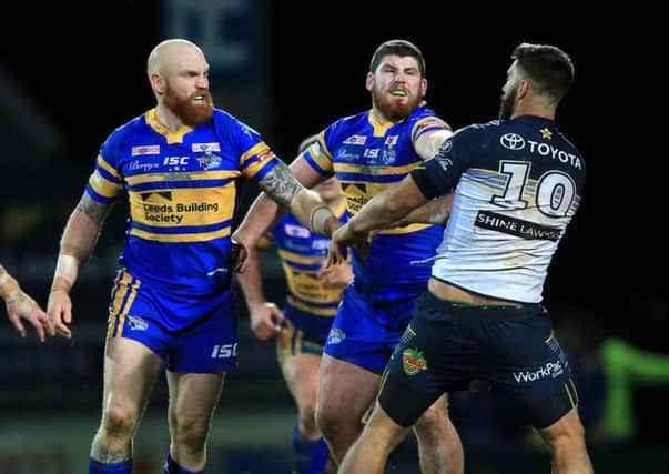 Leeds Rhinos' Mitch Garbutt (second right) was sent off for punching North Queensland Cowboys James Tamou.