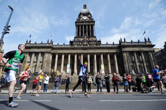 The Leeds Half Marathon, runners run past the Leeds Town Hall.
10th May 2015.
Picture Jonathan Gawthorpe.