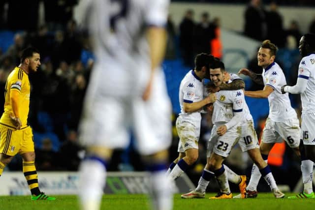 Ross McCormack watches as Lewis Cook celebrates his equaliser. PIC: Bruce Rollinson