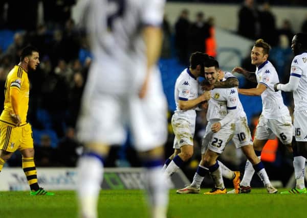 Ross McCormack watches as Lewis Cook celebrates his equaliser. PIC: Bruce Rollinson