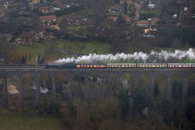 An aerial view of the Flying Scotsman going over the Digswell Viaduct near Welwyn Garden City on its inaugural run from London to York after a decade long, £4.2 million refit. (Picture: Steve Parsons/PA Wire)