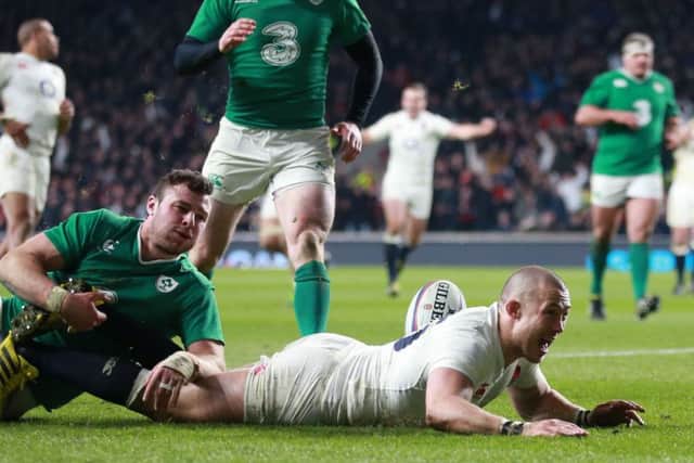 England's Mike Brown scores his side's second try against Ireland.