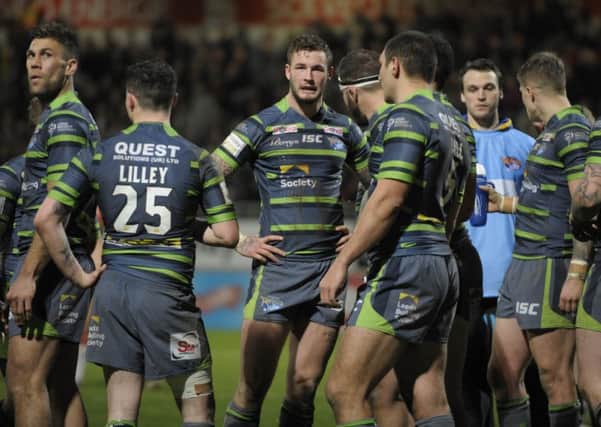 Leeds Rhinos players show their frustration against Catalans Dragons.