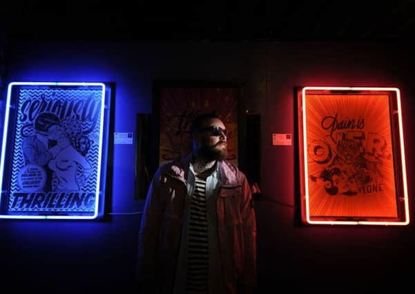 Leeds artist 'Tone' pictured with his work.
Picture by Simon Hulme