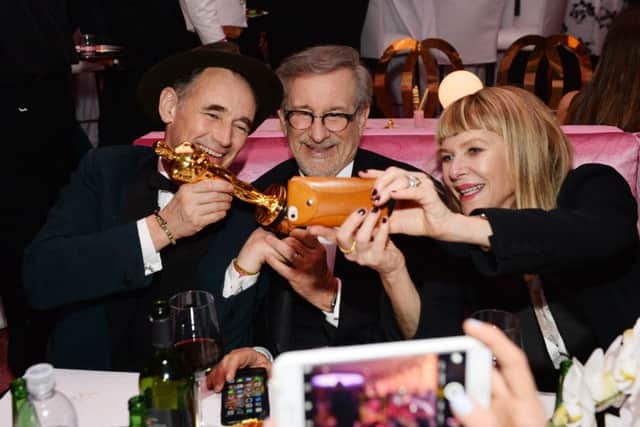 Mark Rylance, winner of the award for best actor in a supporting role for Bridge of Spies, from left, Steven Spielberg and  Kate Capshaw attend the Governors Ball after the Oscars
