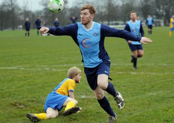 Tom Bailey, of Wortley, heads for goal at Horsforth St Margaret's.