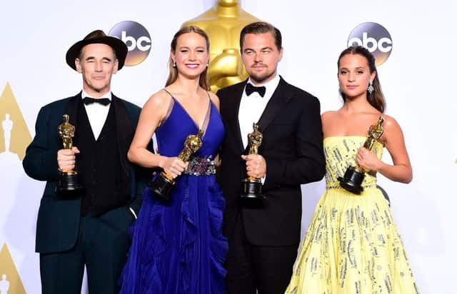 They wore yellow, they wore blue, they mainly wore black suits: (left to right) Mark Rylance with the Academy Award for Best Supporting Actor, Brie Larson with the Academy Award for Best Actress, Leonardo DiCaprio with the Academy Award for Best Actor and Alicia Vikander with the Academy Award for Best Supporting Actress in the press room of the 88th Academy Awards held at the Dolby Theatre in Hollywood, Los Angeles, Ian West/PA Wire