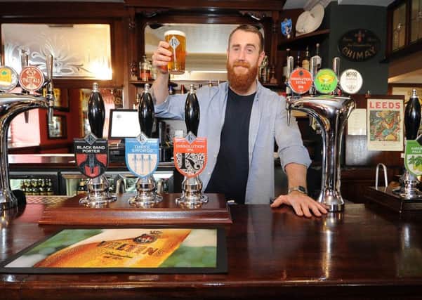 Date:15th June 2015. Picture James Hardisty, (JH1008/99g) Old Bridge Inn, Kirkstall, Leeds, has been voted for the second year running the Leeds Camra Pub of the Year. Pictured Landlord Ian Forster, celebrating his success.