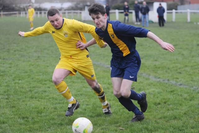 Liam Clark of  East End Park takes on Gareth Peel of  Old Centralians